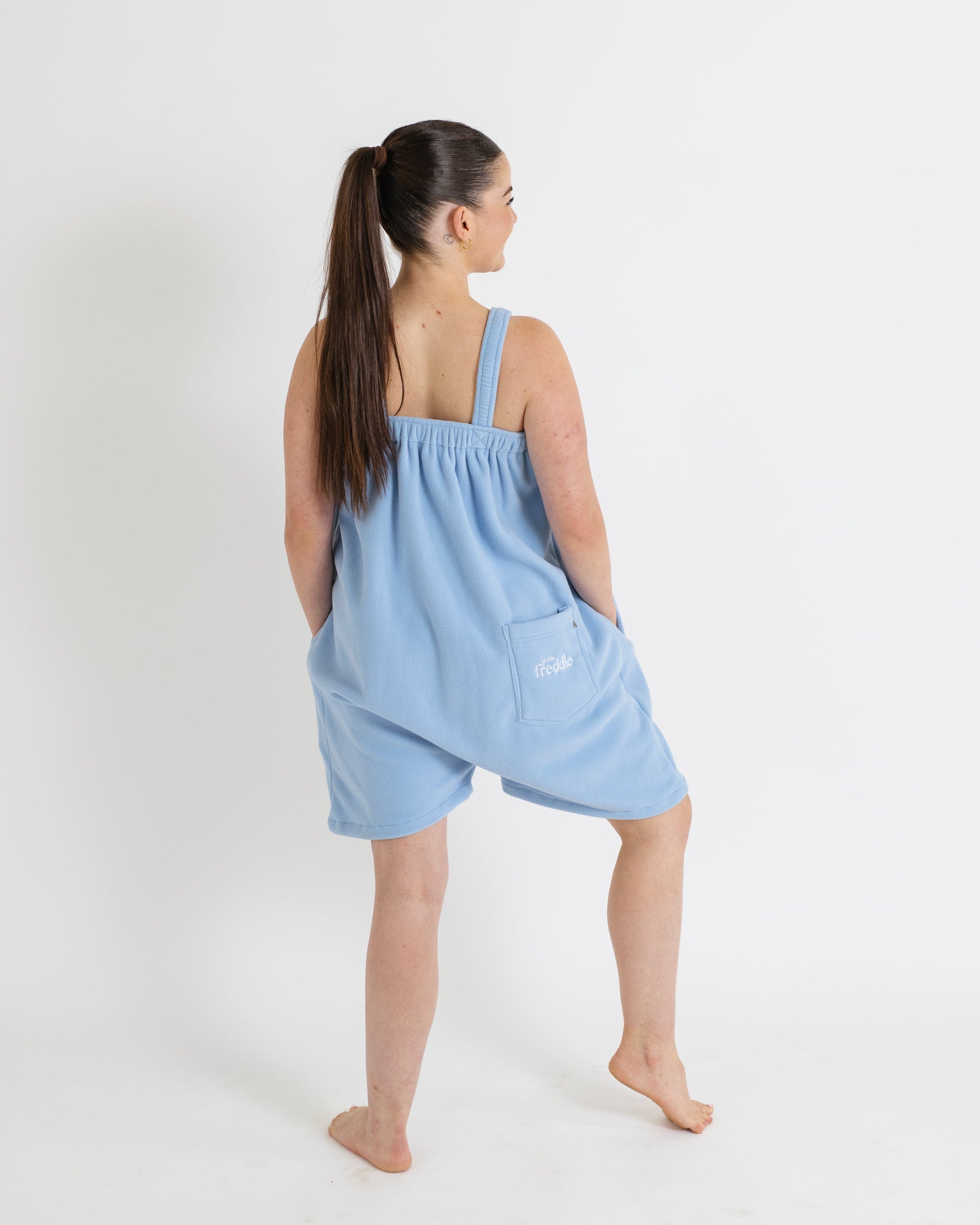 Woman wearing a light blue Ready Freddie  in short style 