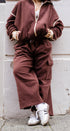 Brown fleece track pants with signature stripe detail