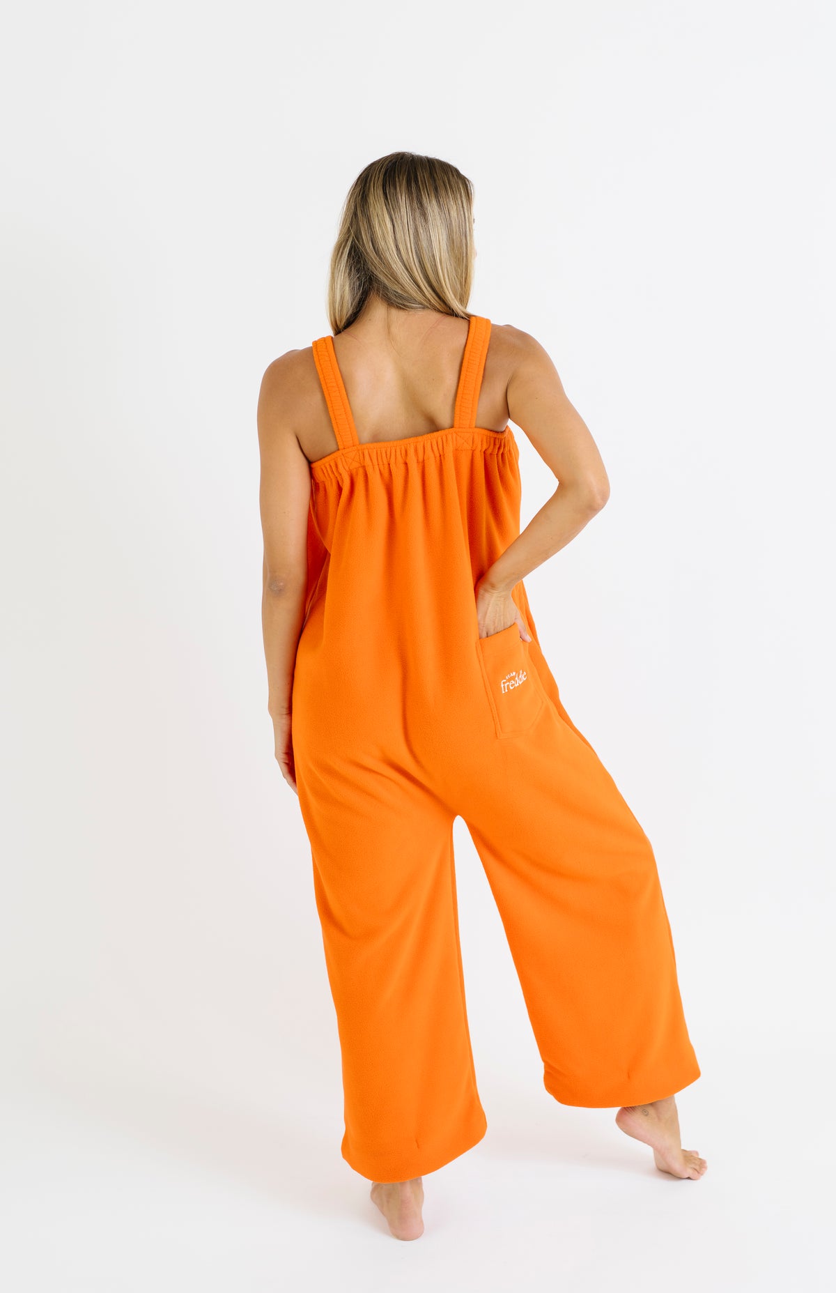 Orange long fleece onesie for getting ready
