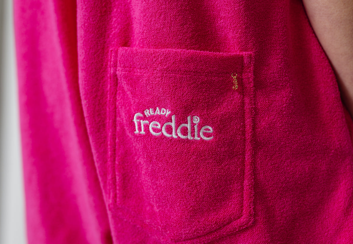 Tropical pink towel onesie in soft terry toweling fabric